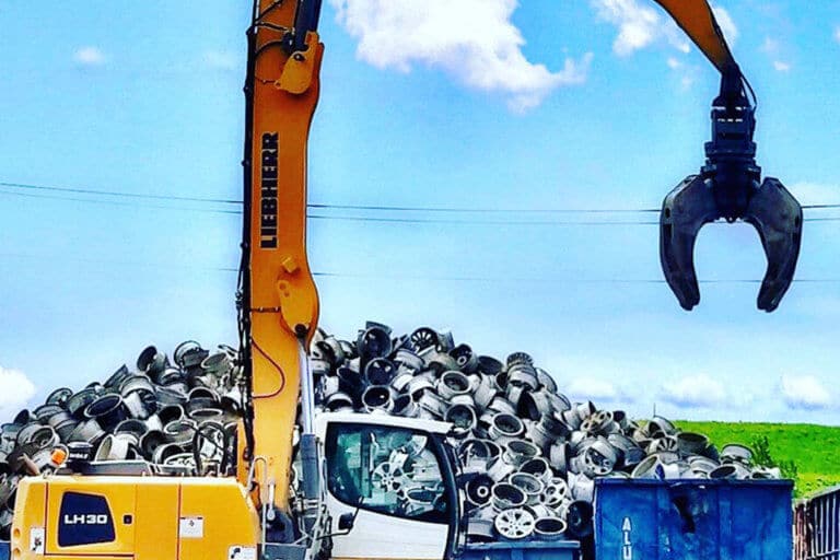 A pile of automobile wheels sold as scrap at upstate Shredding