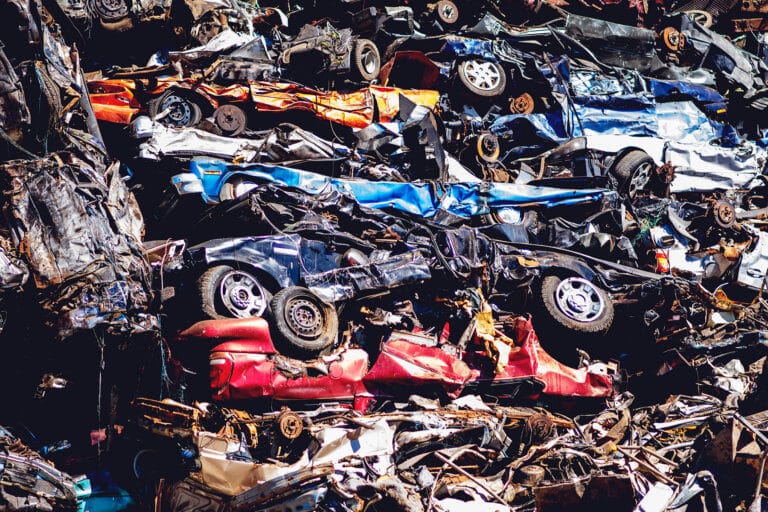 A pile of cars that will be recycled at Upstate Shredding